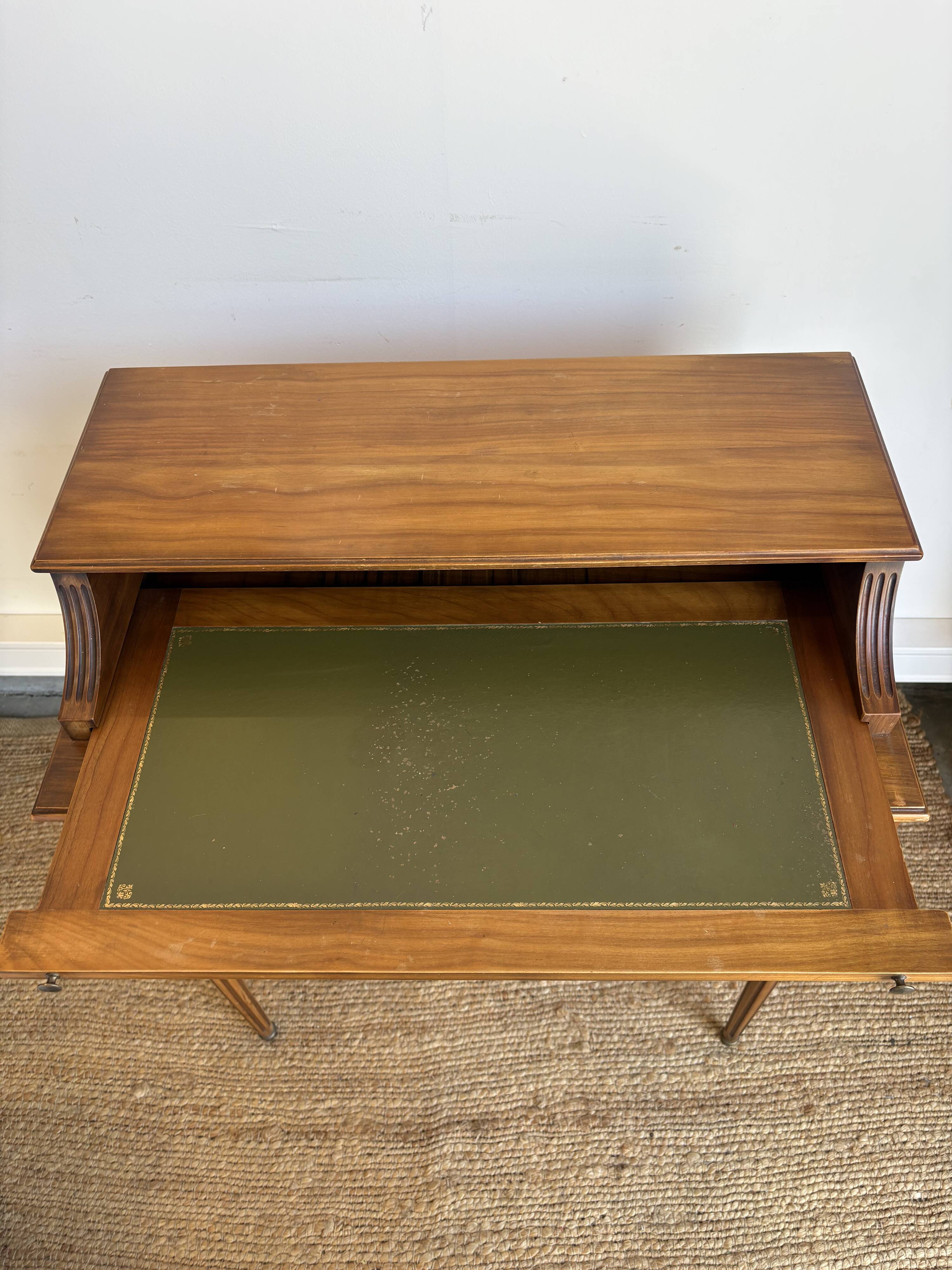 Louis XVI style mahogany telephone table with a green leather top.