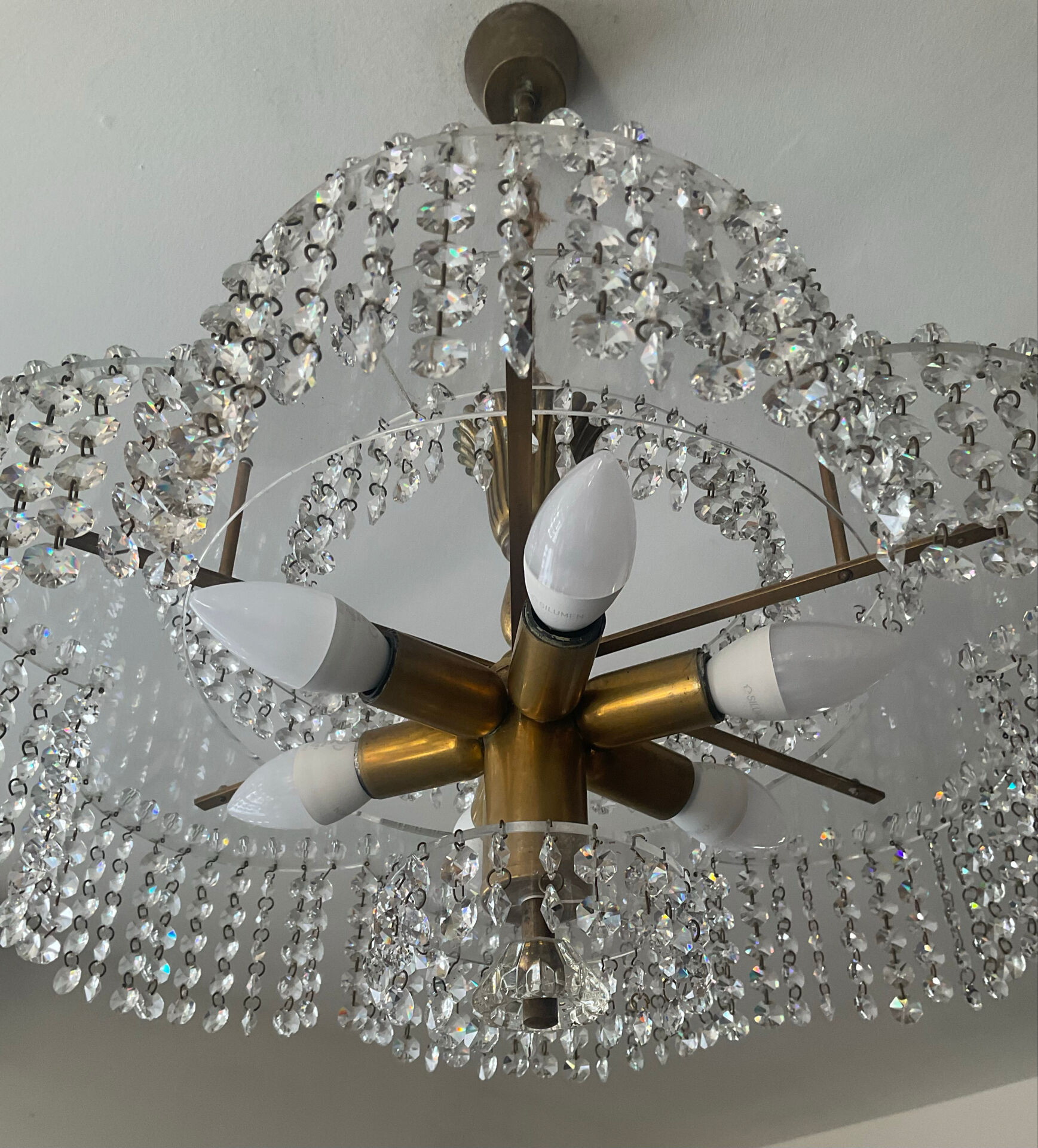 Vintage lucite chandelier with a cascade of crystal pendants from the 1970s.