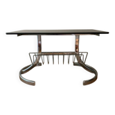 Space Age coffee table in chrome metal and smoked glass with magazine rack – Circa 1970