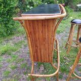 Vintage rattan bar with 1960s earthenware tile decor with 2 stools