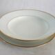 Set of 11 Limoges porcelain soup plates