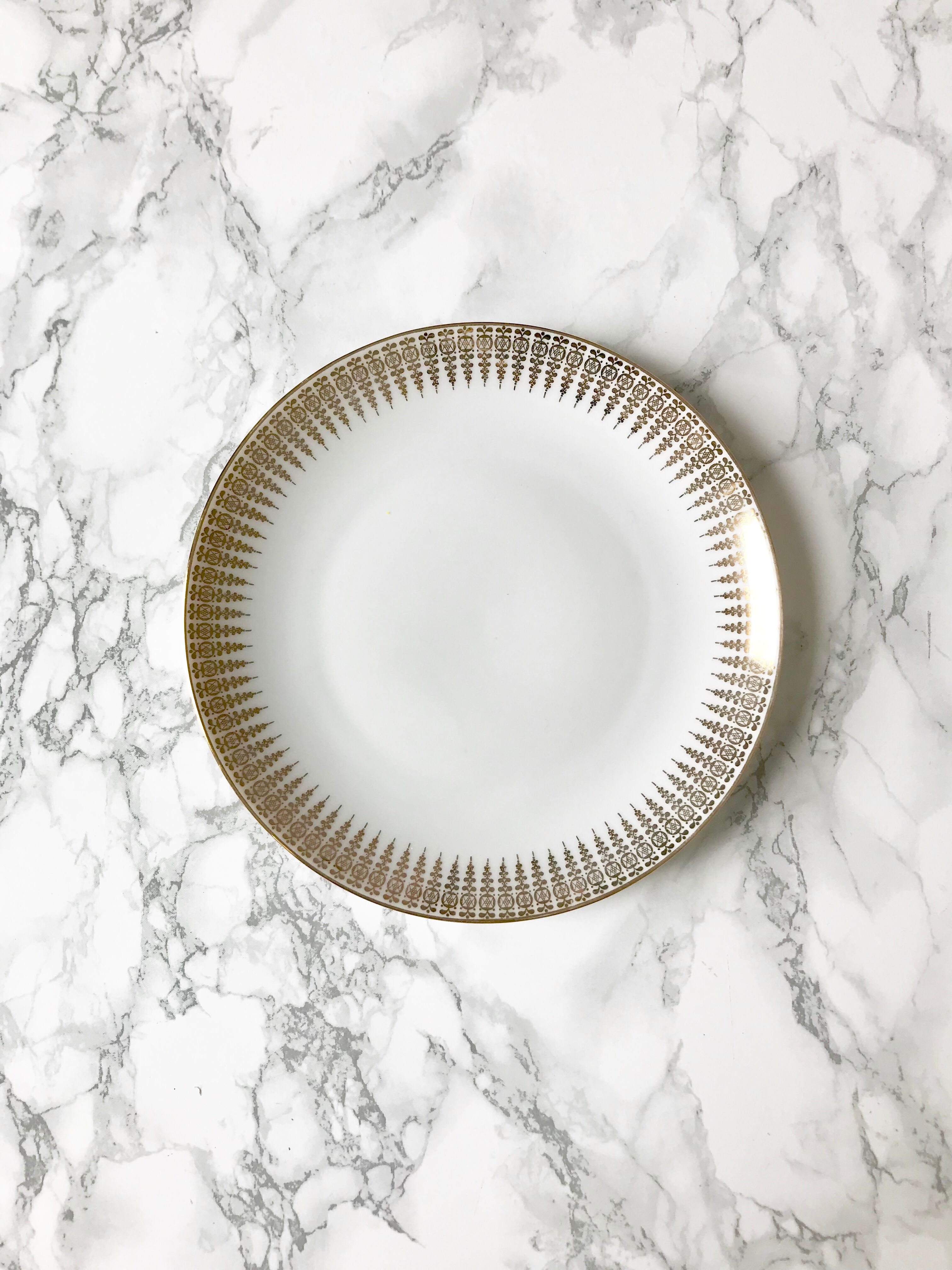 Six white and gold porcelain dessert plates
