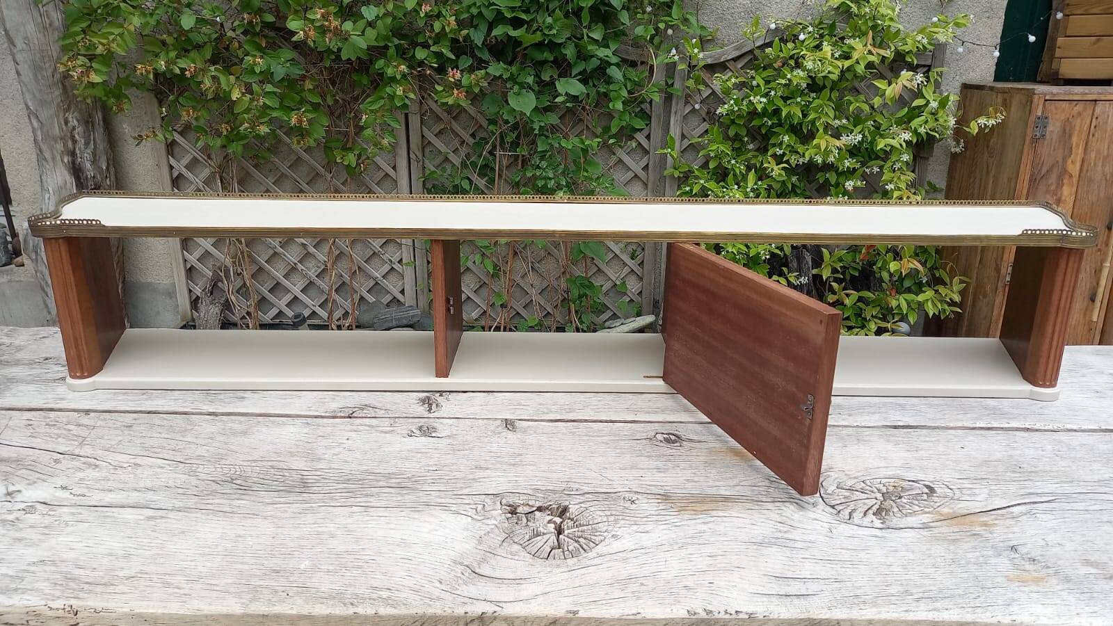 Wall shelf bookcase with brass frieze