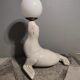 White ceramic sea lion lamp and opaline globe