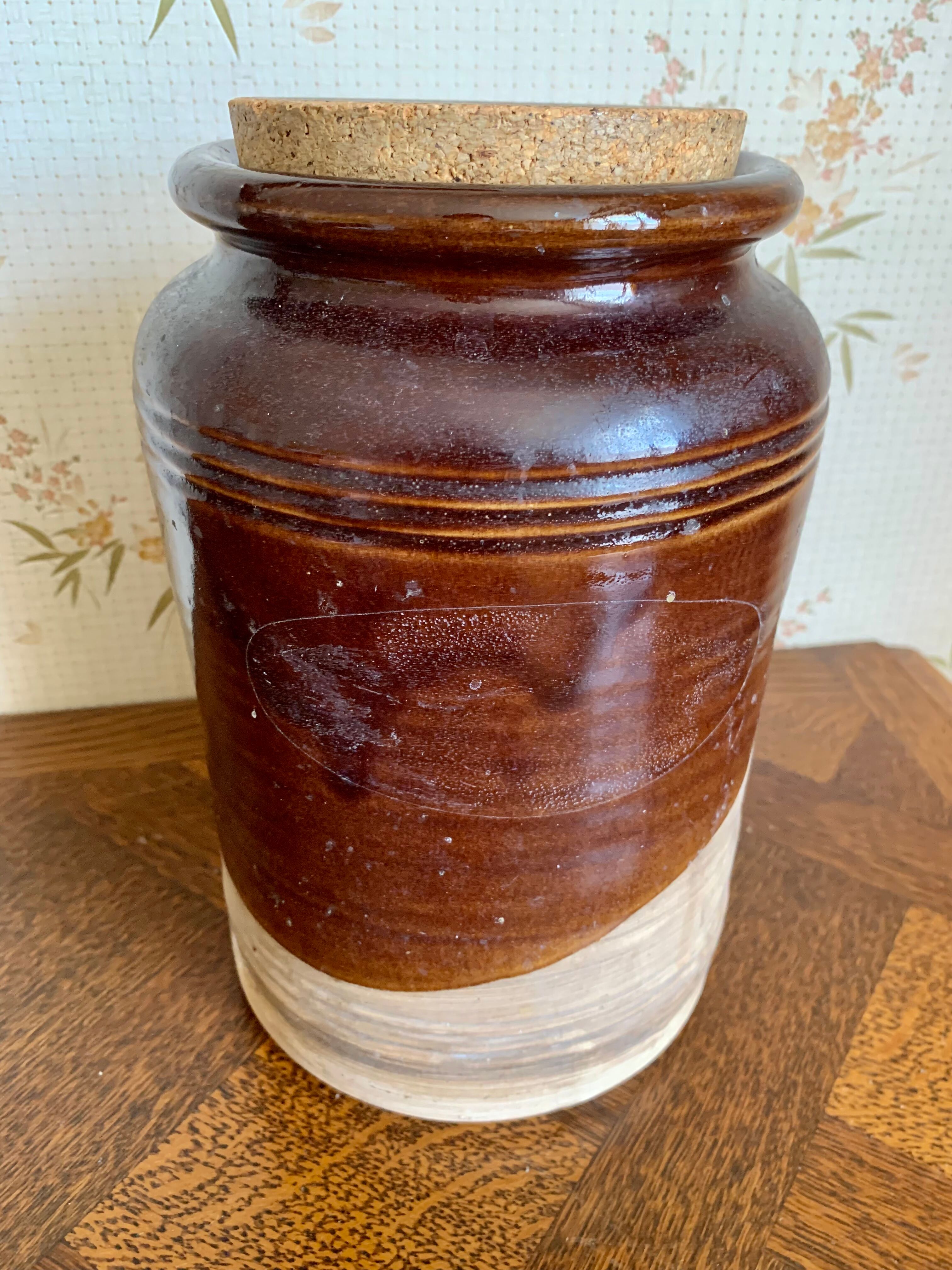 Old sandstone pot with cork lid