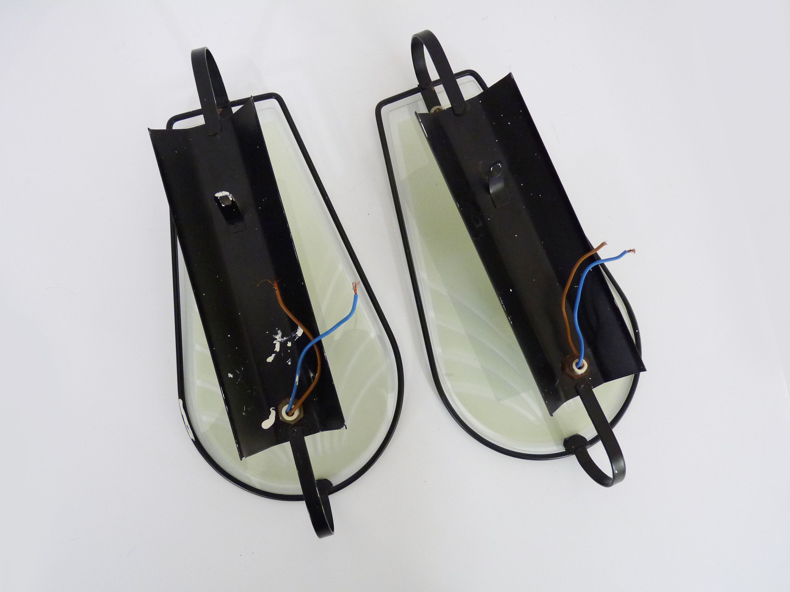 Pair of vintage wall appliques in black metal and blue patterned glass. Year 70