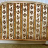 Louis XVI style bed in patinated wood with fluted columns.