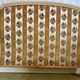 Louis XVI style bed in patinated wood with fluted columns.