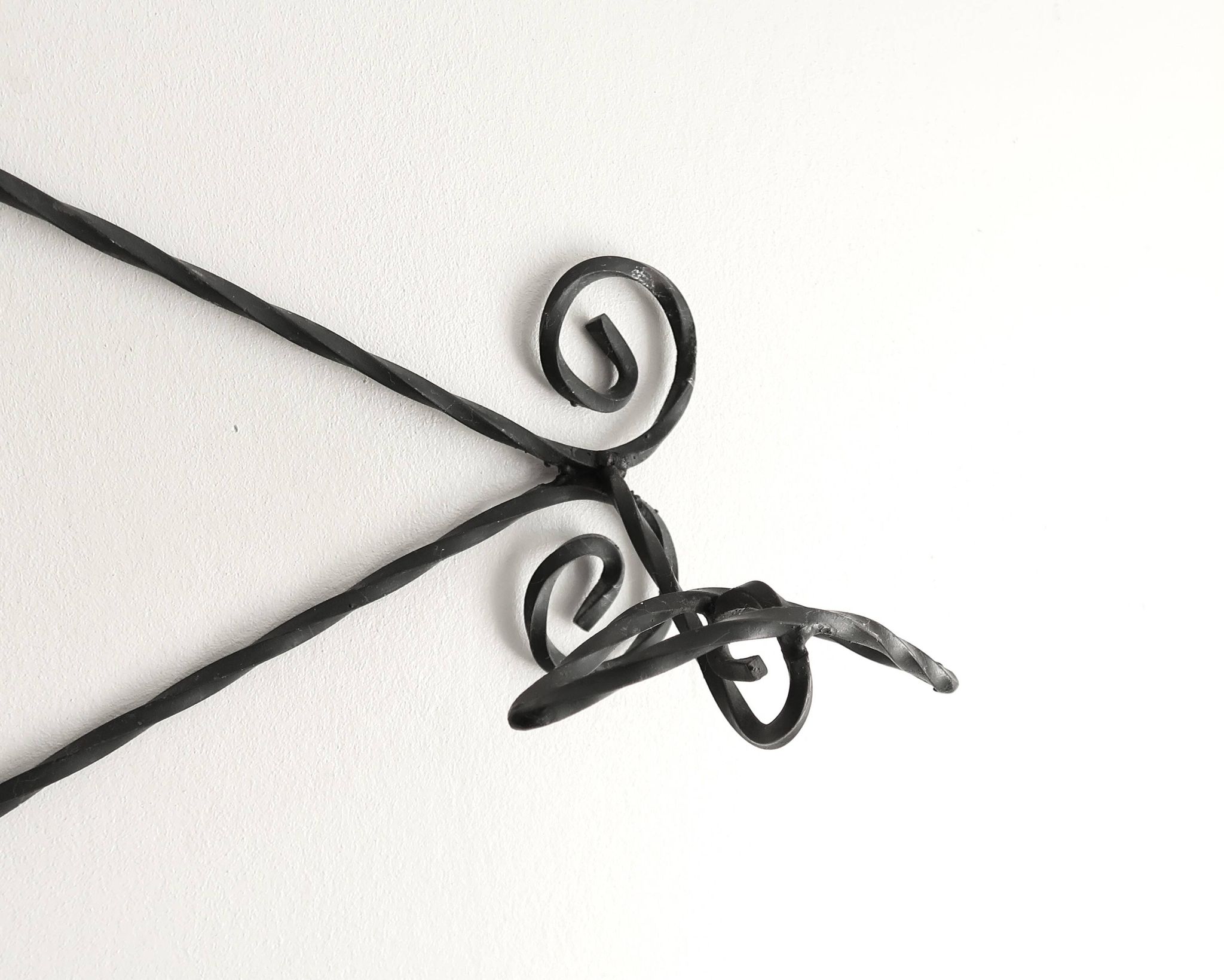 Twisted wrought iron wall coat rack with three hooks