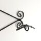 Twisted wrought iron wall coat rack with three hooks