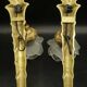 Pair of single-light wall sconces in the Louis XVI torch style - gilded bronze
