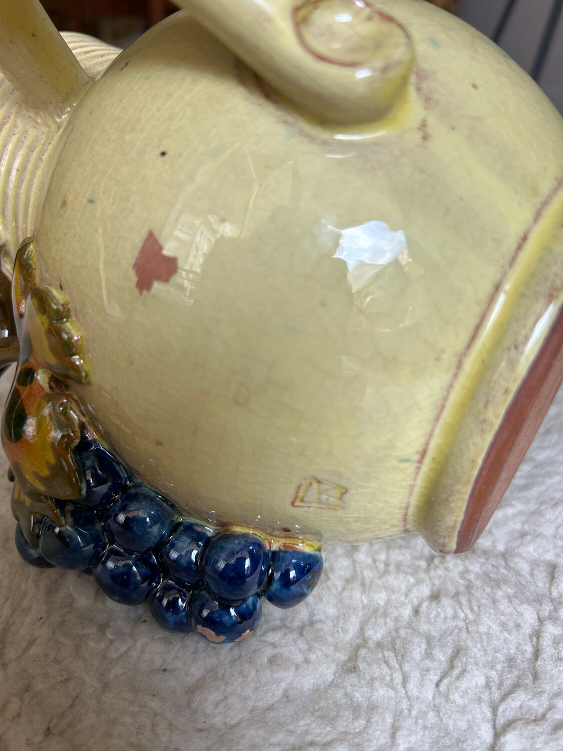 Earthenware jug/carafe HB with grape bunch slip decoration.