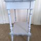 Side table with mirror interior and storage lockers