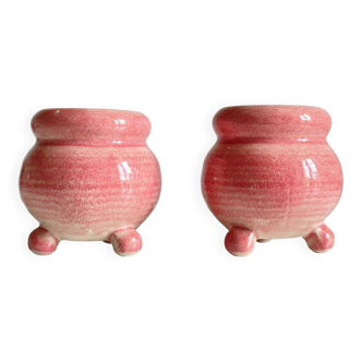 Pair of ceramic candle holders in pink.