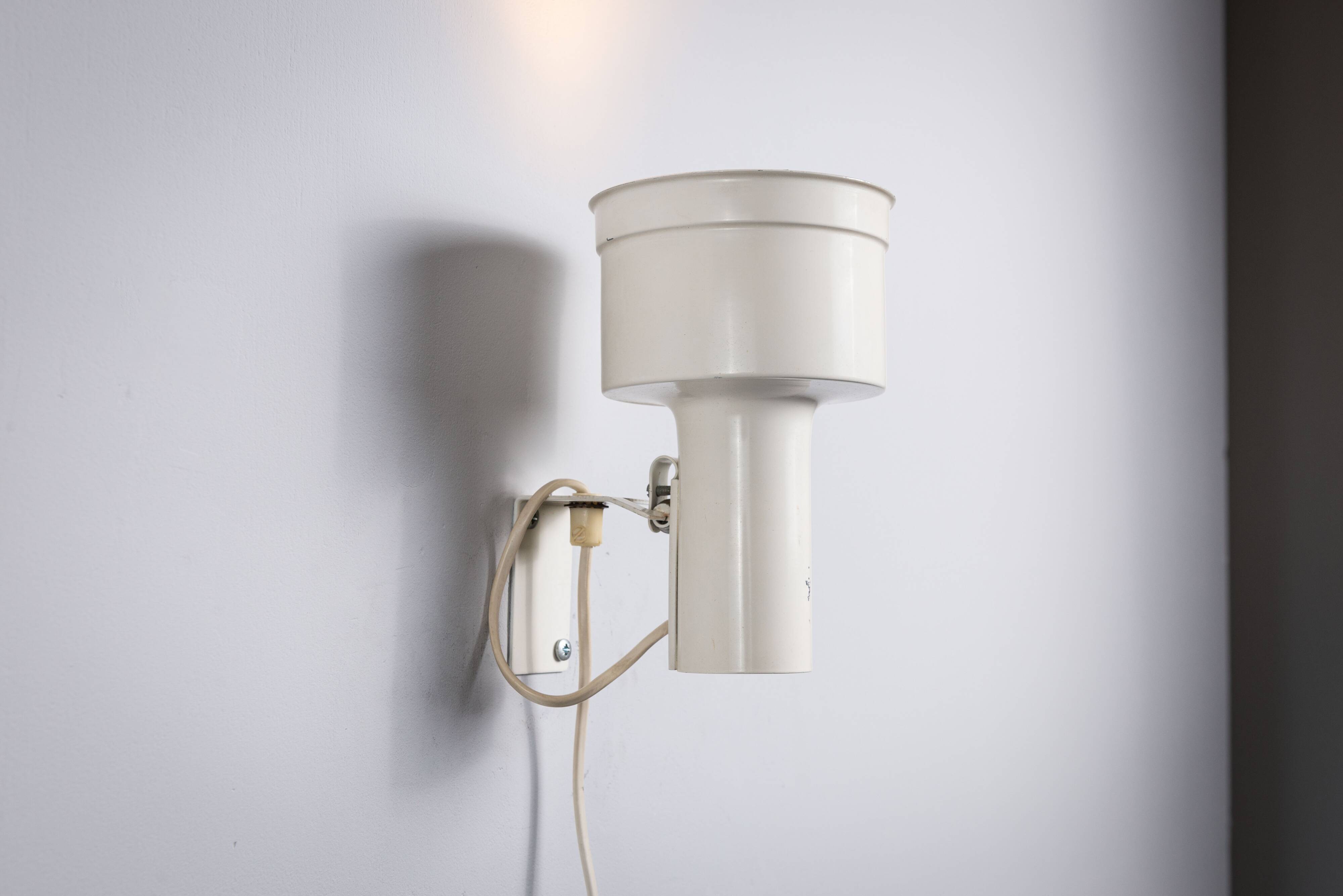Pair of adjustable wall lamps designed by Per Sundstedt for Kosta Lampan
