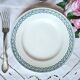 Mismatched antique flat plates made of ironstone accompanied by