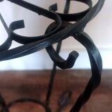 Black wrought iron support for plants