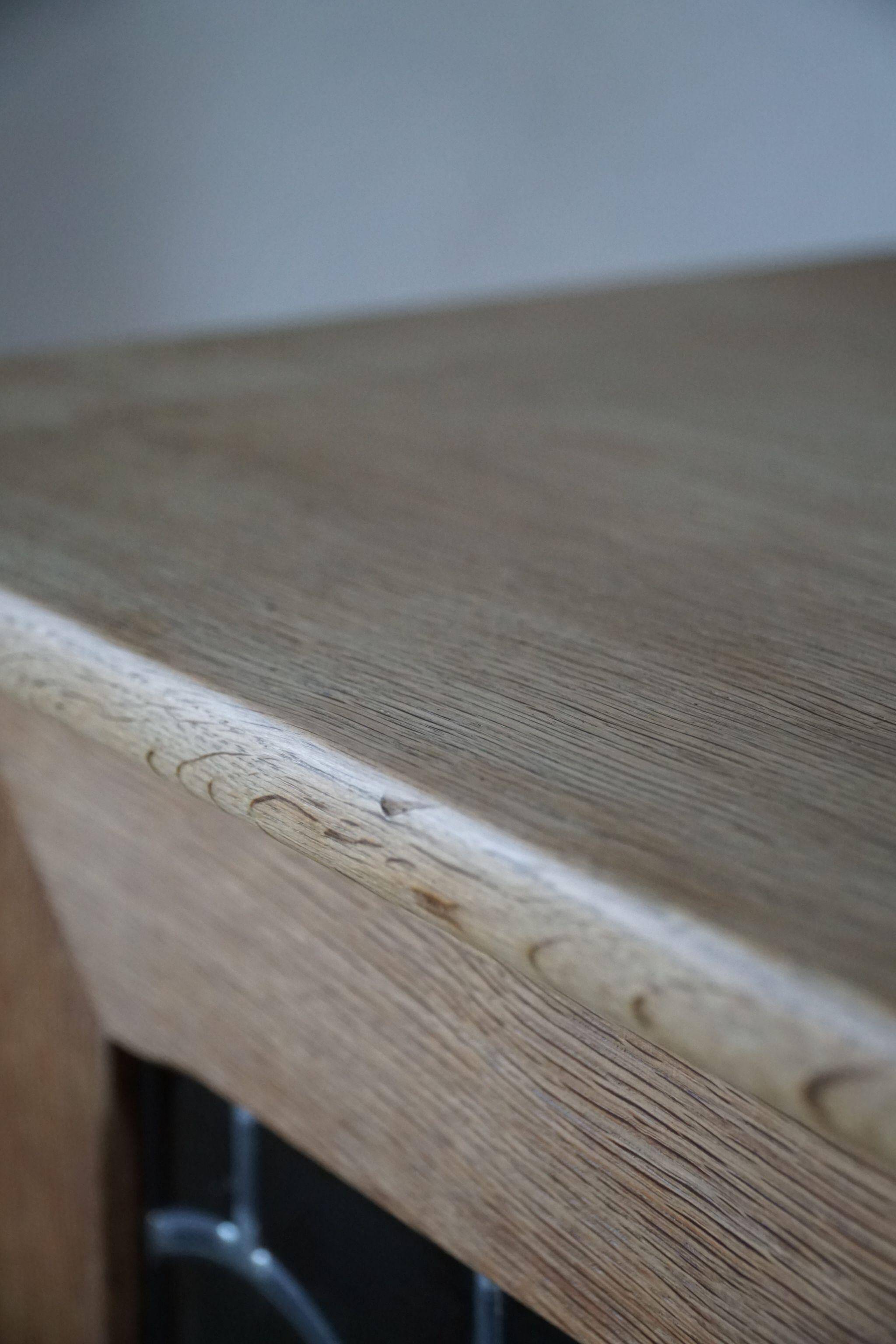 20th-century mid-century solid oak sideboard with glass front, by a Danish cabinetmaker.