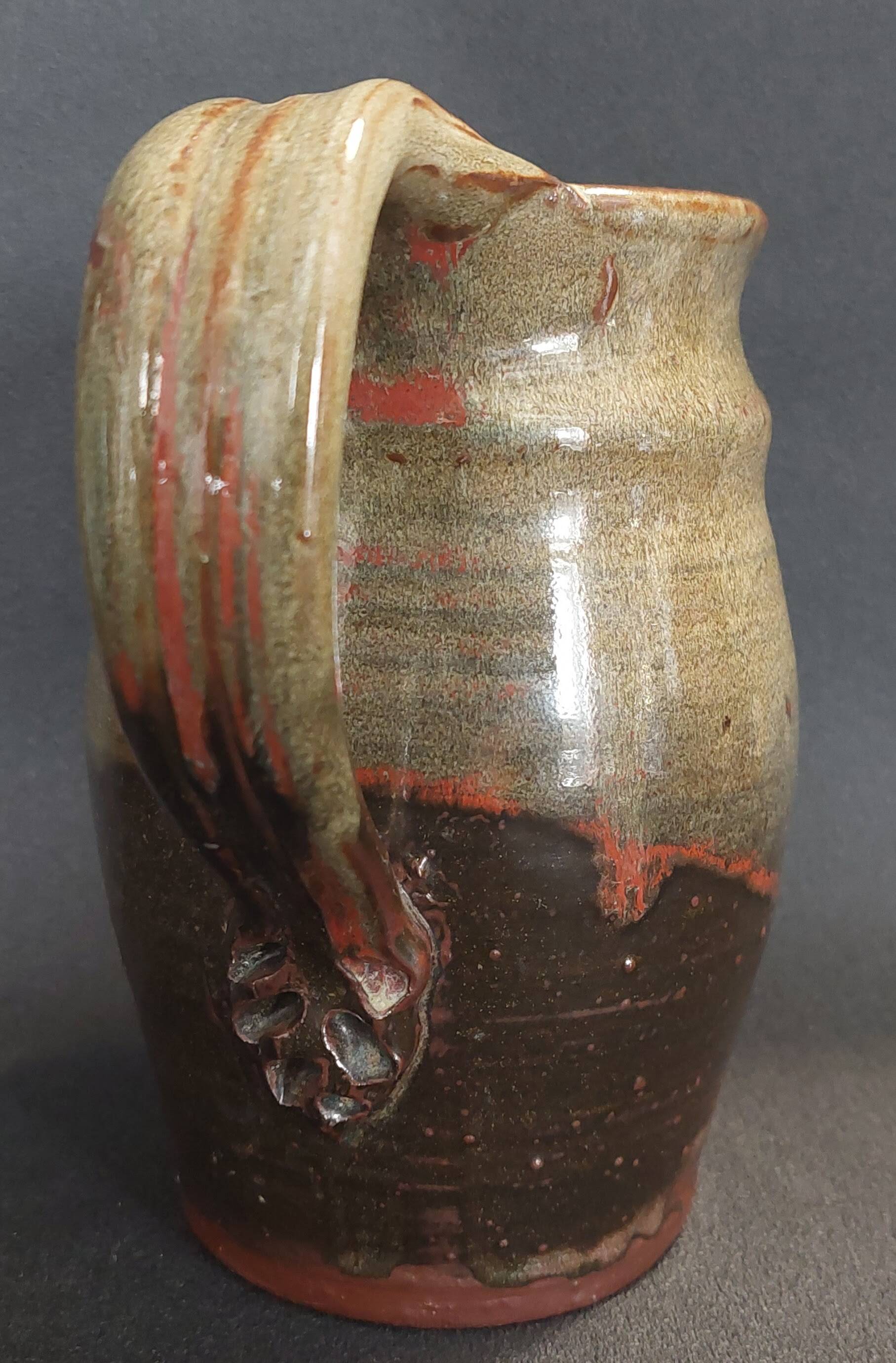 Ceramic pitcher from the 20th century with a signature to identify.