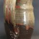 Ceramic pitcher from the 20th century with a signature to identify.