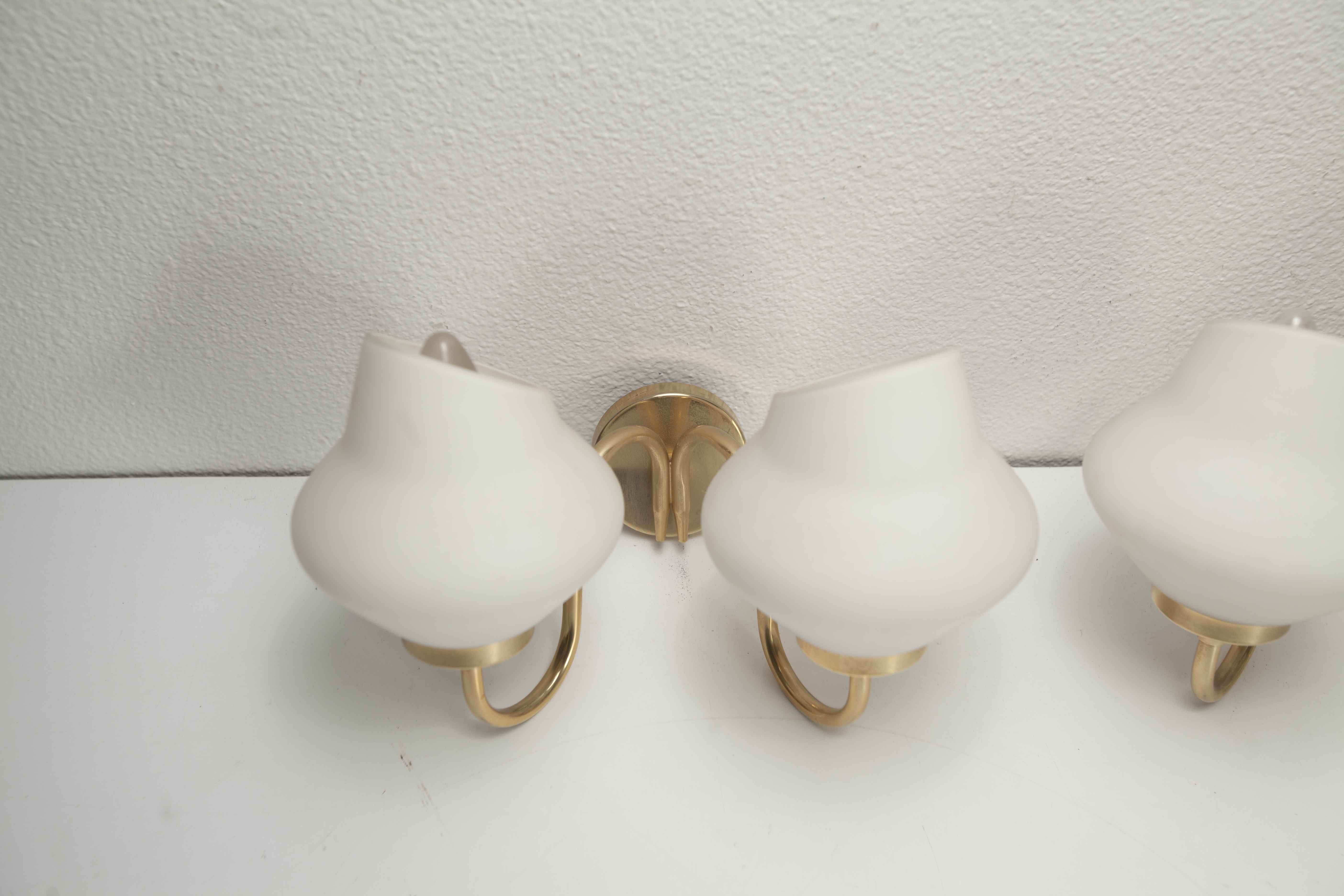 Pair of 60s brass and opaline sconces