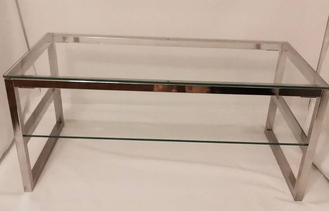 1980s coffee table with a double chrome metal top.