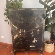 Magnificent black and gold lacquered Chinese cabinet.
