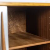 Low ash sideboard with sliding doors. 1960s.