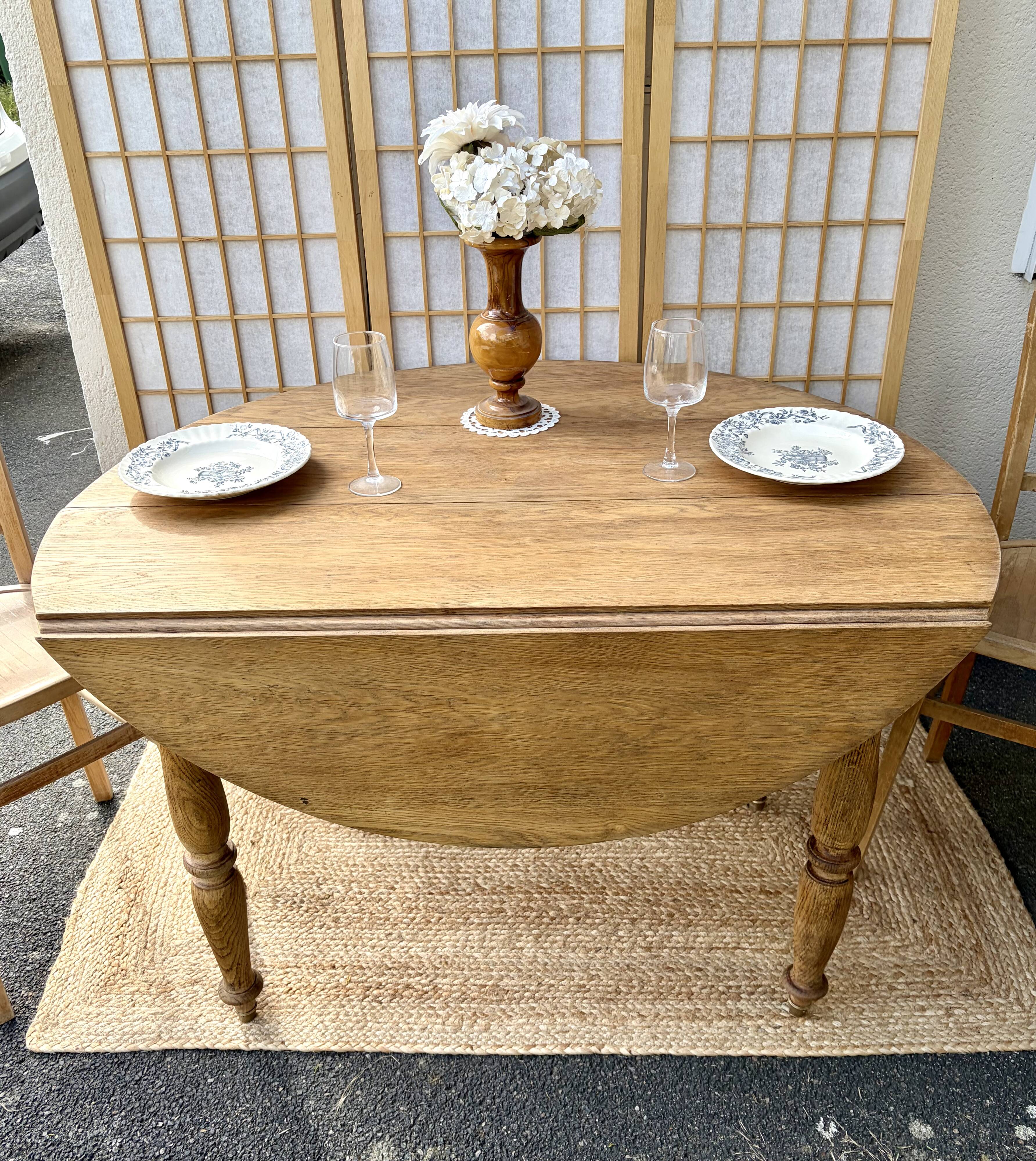 Round oak table with a drop leaf.