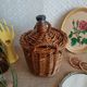 Small canister demijohn in glass circled with wicker - vintage