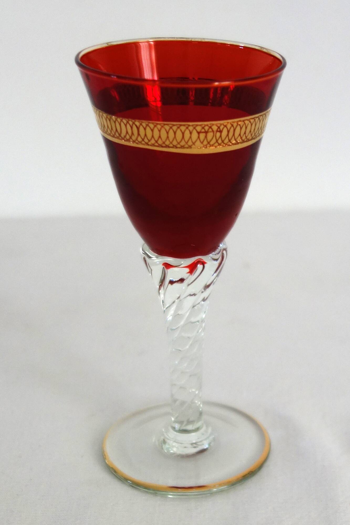 6 multicolored aperitif glasses with twisted legs