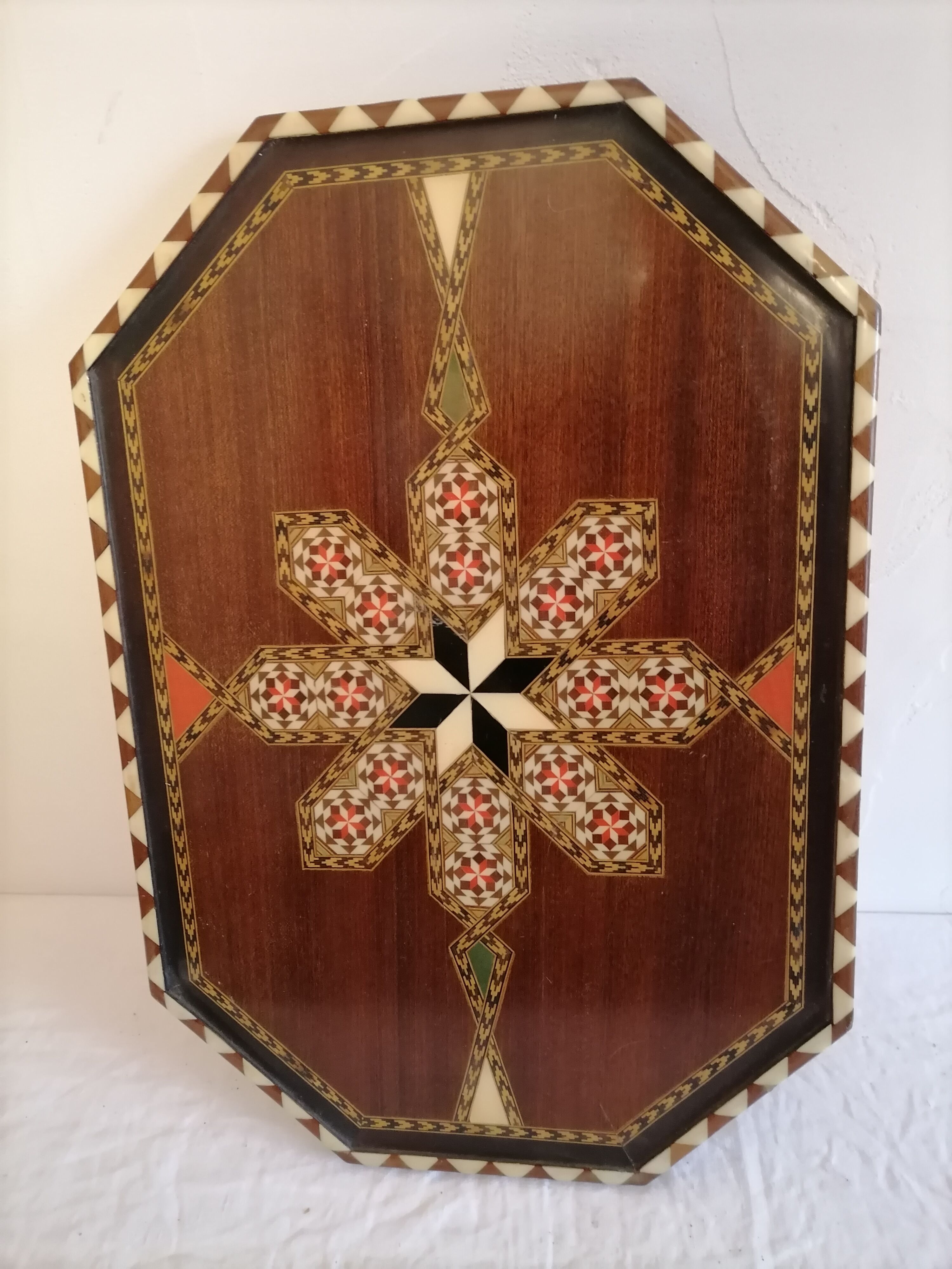 Old oriental plateau in marquetry.