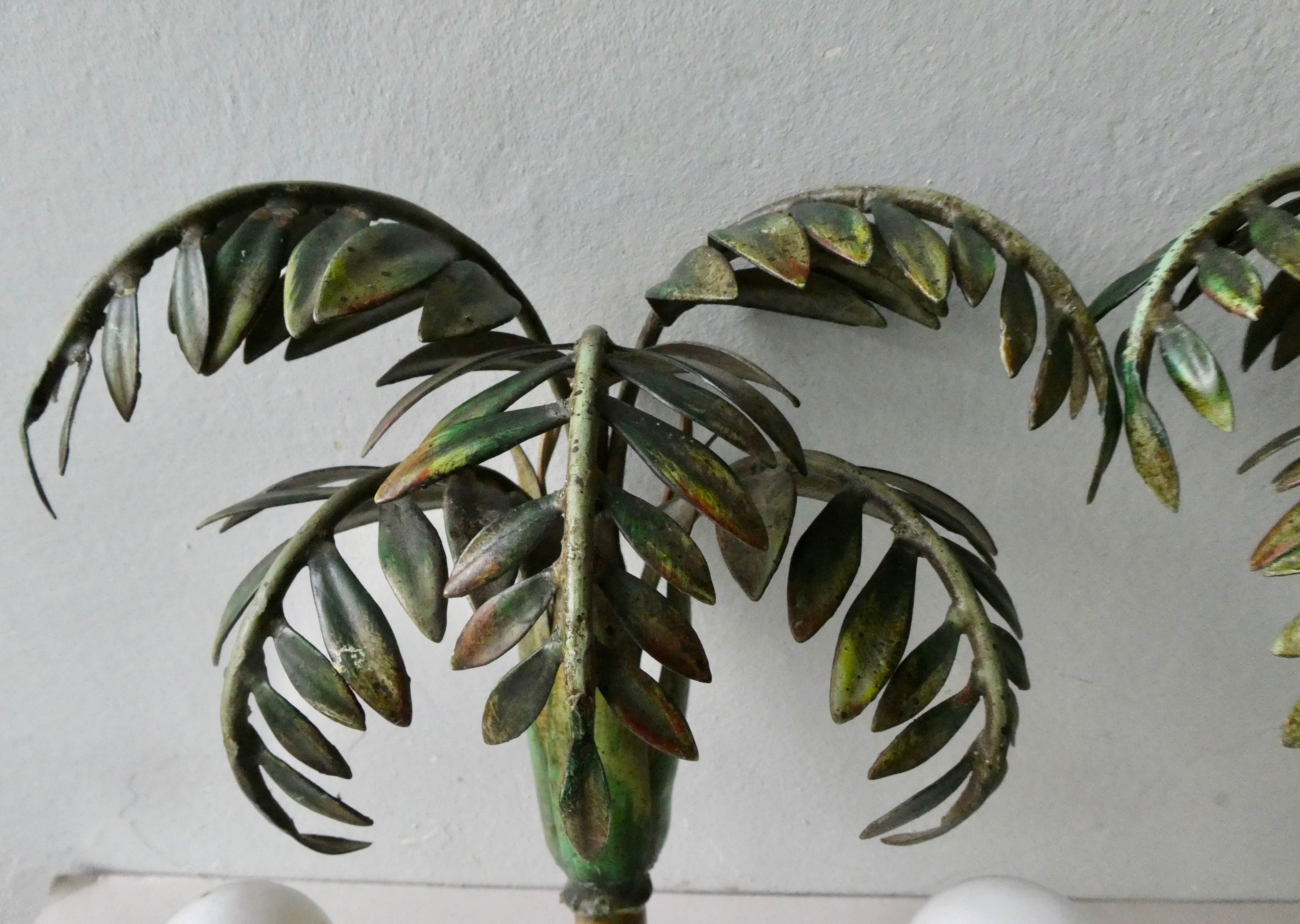 Pair of bamboo and palm sconces in metal