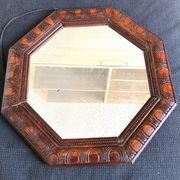 Octagonal mirror, glossy varnished oak, Art Deco.