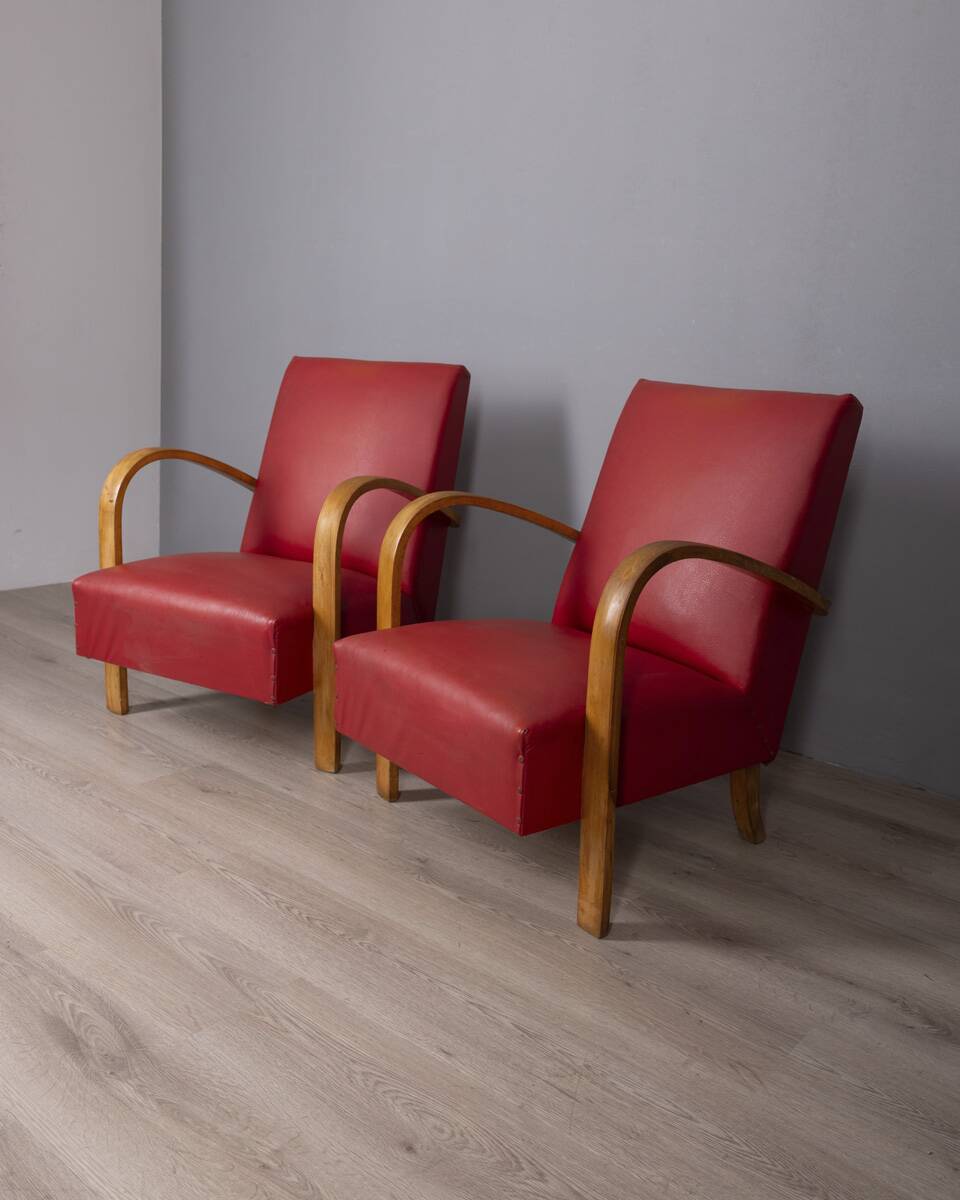 Pair of vintage 1950's armchairs in red leather, italian design