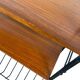 Vintage black shelf/coat rack with wooden accents.