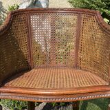 Fauteuil en bois fruitier et cannage style Louis XVl