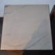 Pair of wooden and marble side tables