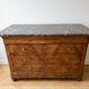 Antique walnut commode with a grey marble top.