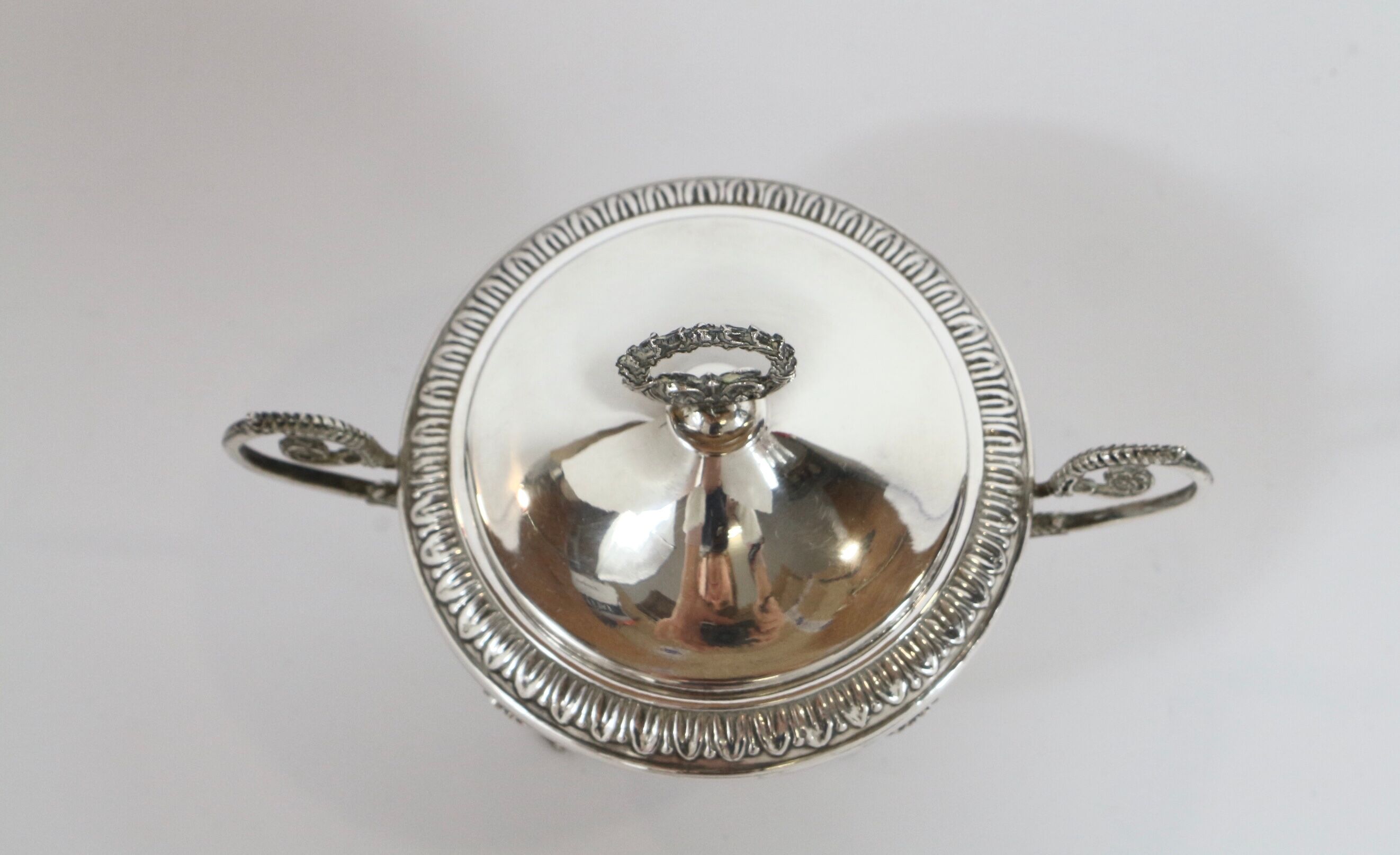 Silver sugar bowl with paw feet and ornate handles