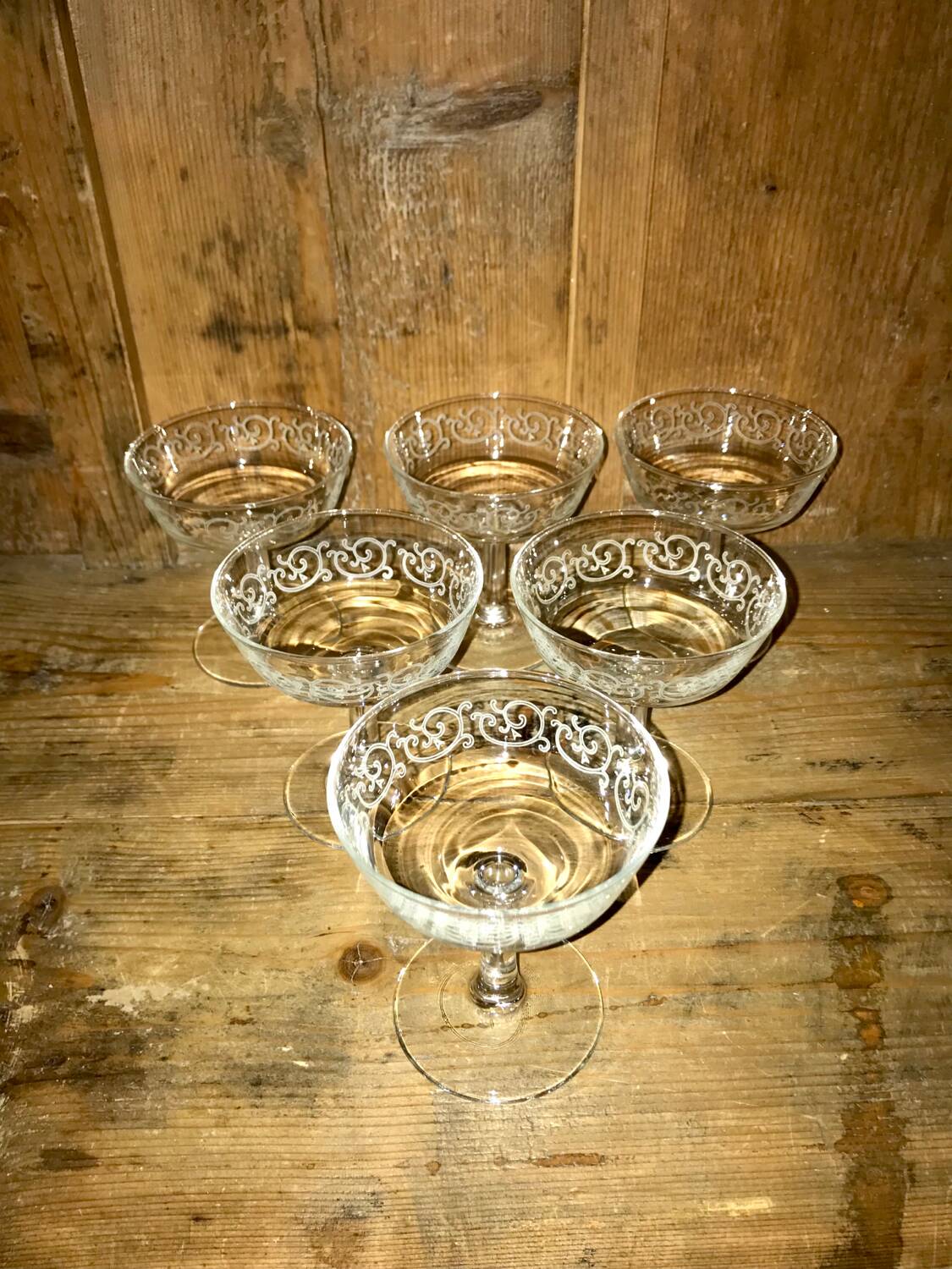 Set of old glasses with white arabesque pattern