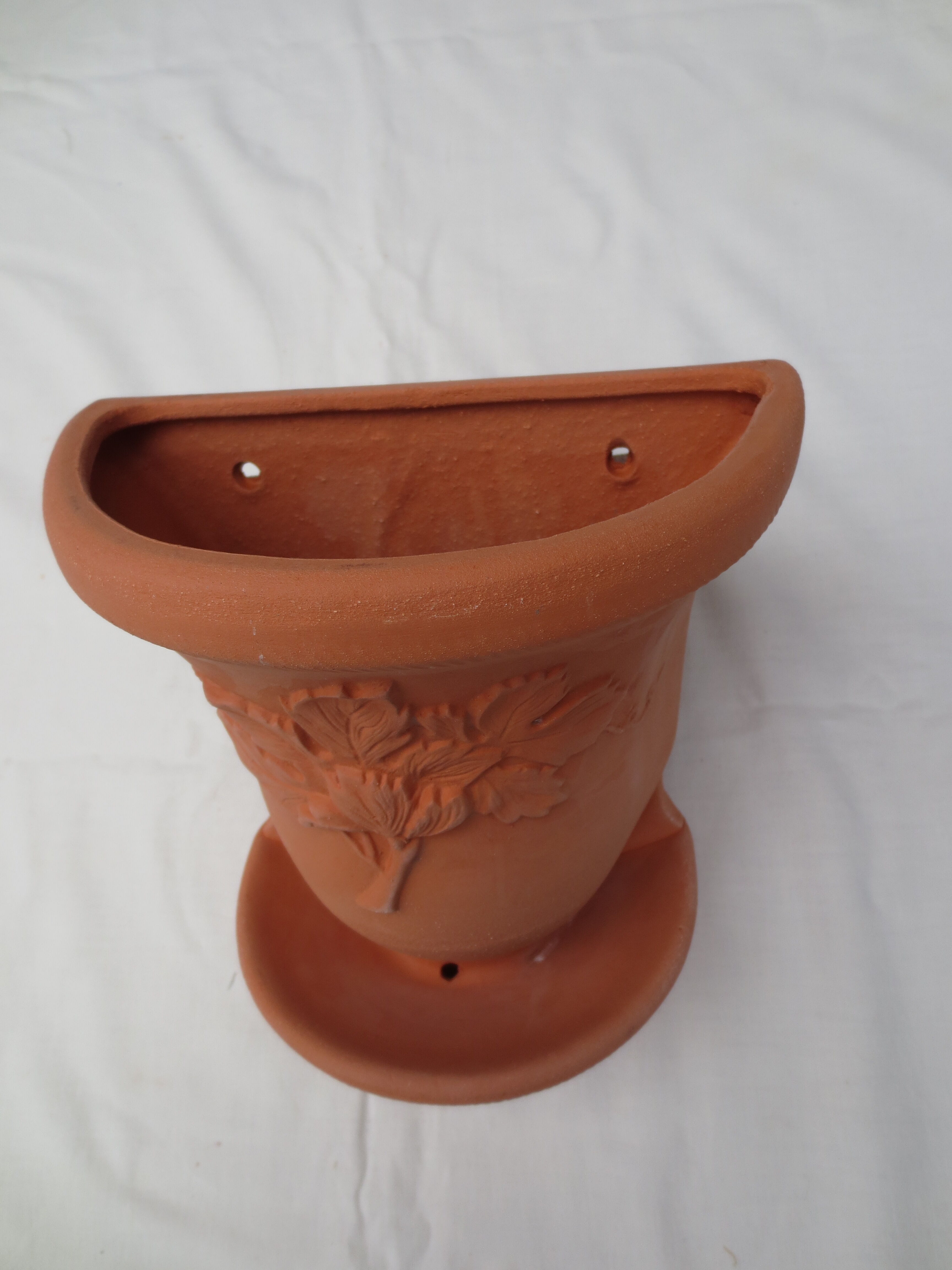 Pair of decorated terracotta wall flower pots
