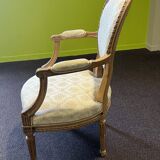Pair of Louis XVI style armchairs, in solid walnut, re-edged and upholstered, pegged