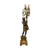 Torchère a décor d'un nubien en bois et stuc doré XX siècle