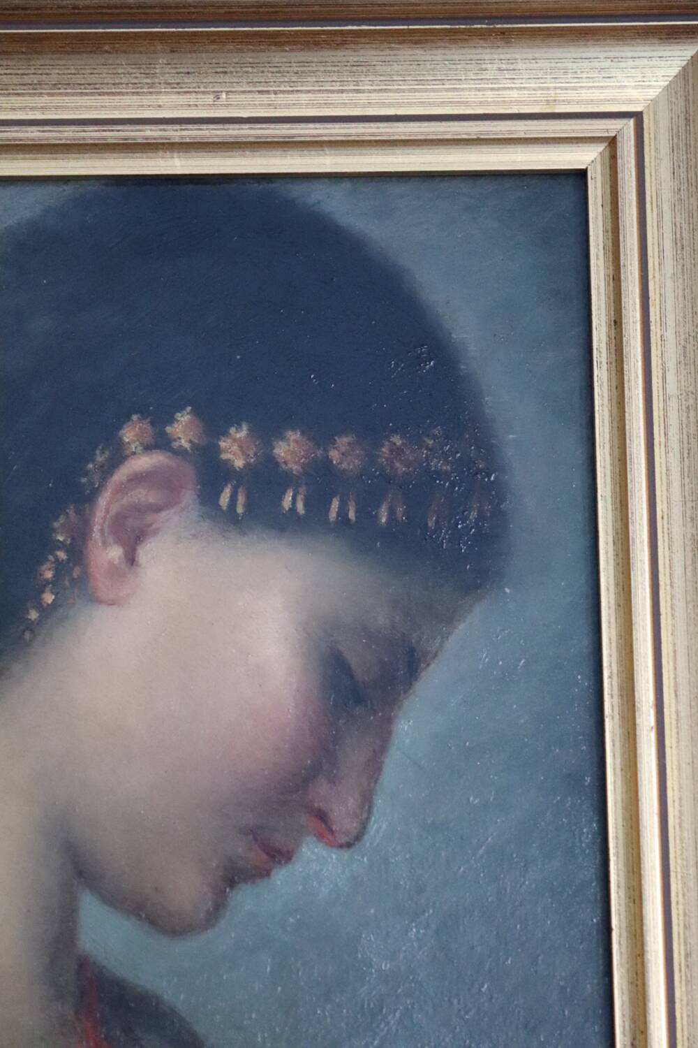 Old oil portrait of a woman on panel