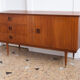 Teak and brass 140cm