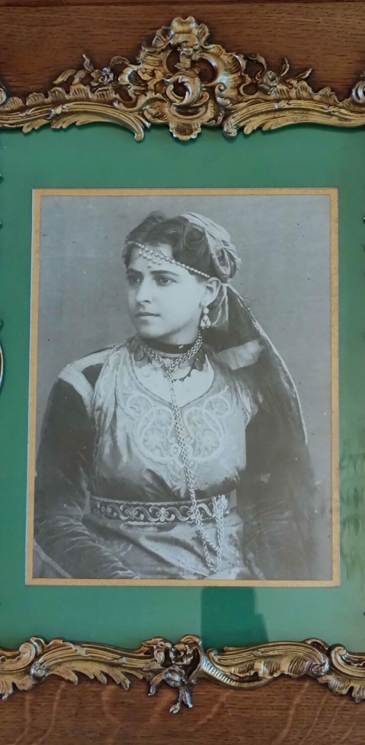 Old wooden frame and bronze ornament