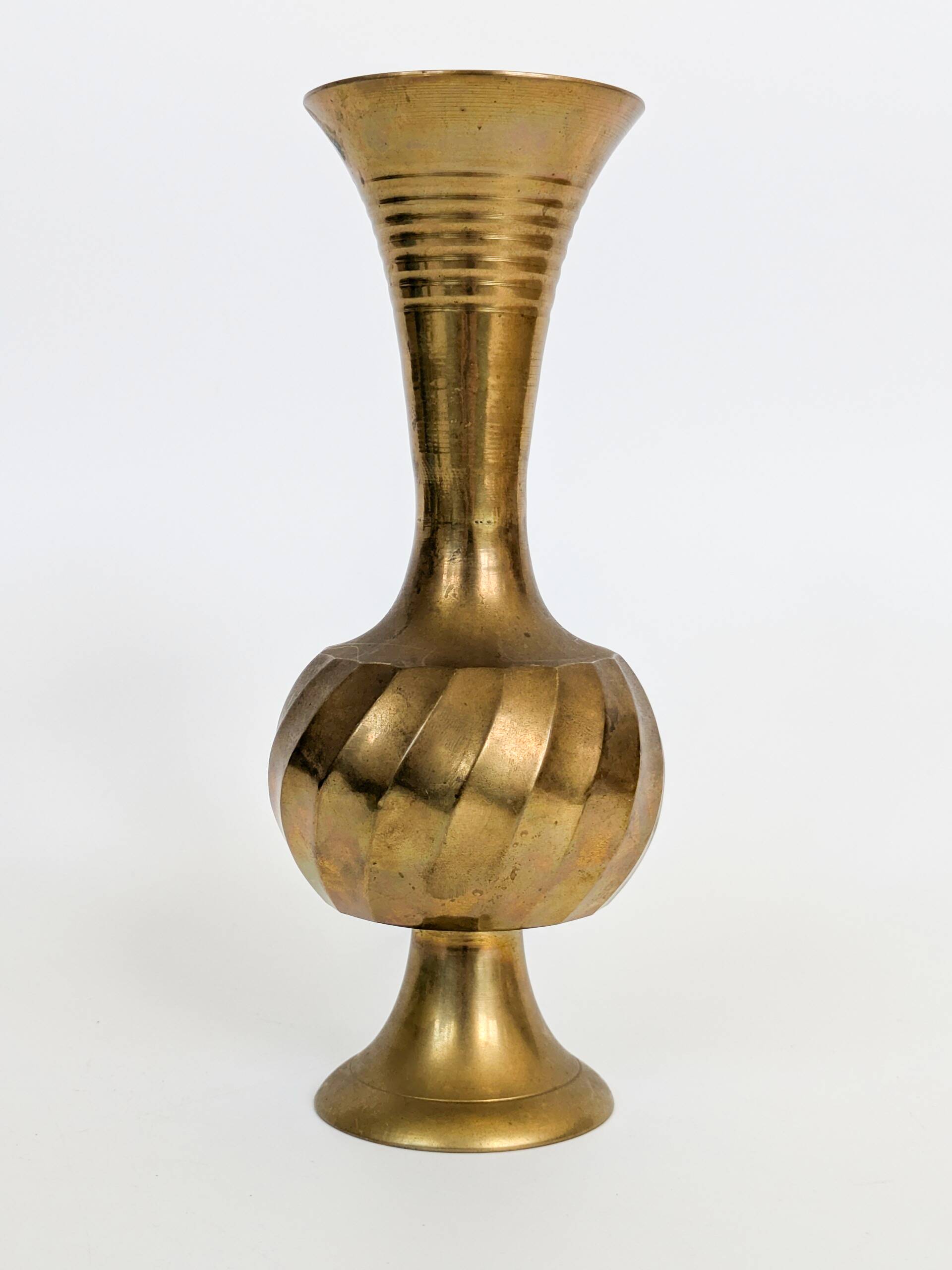 Solid brass Midcentury vase in trumpet shape with twisted details.
