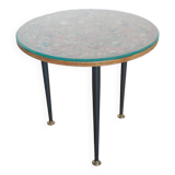 Small side table decorated with cigar rings under beveled glass