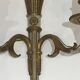 Pair of Louis XVI style wall sconces in bronze with an off-white patina